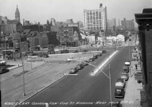 a black and white photo of Vine Street in the process of being widened